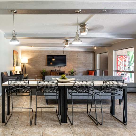 a dining room with a table and chairs