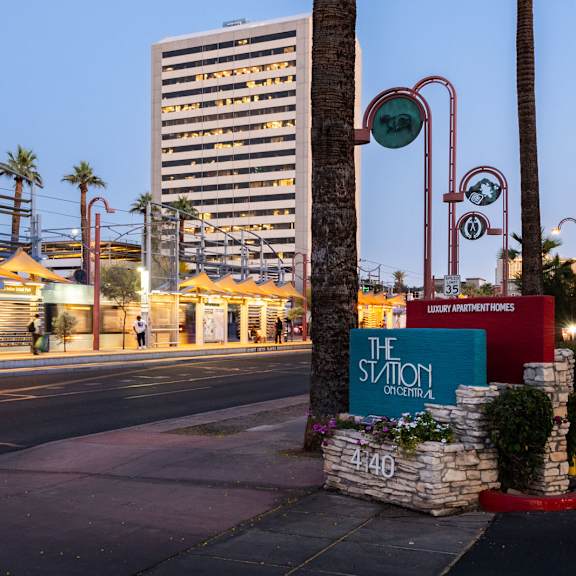 a street view of a city with a sign that reads "the station".
