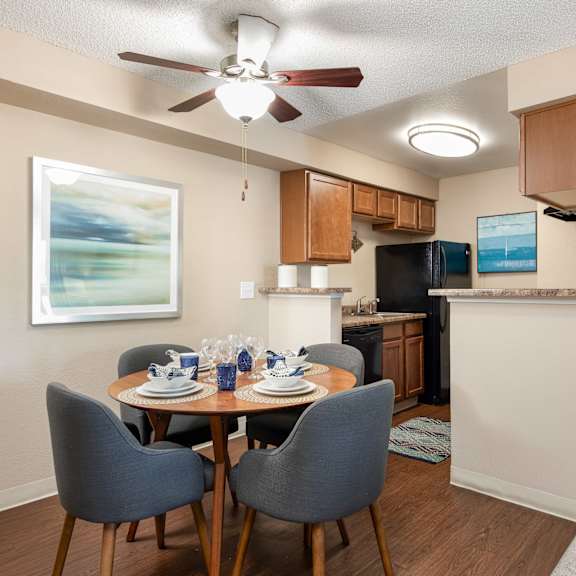 an open kitchen and dining room with a table and chairs