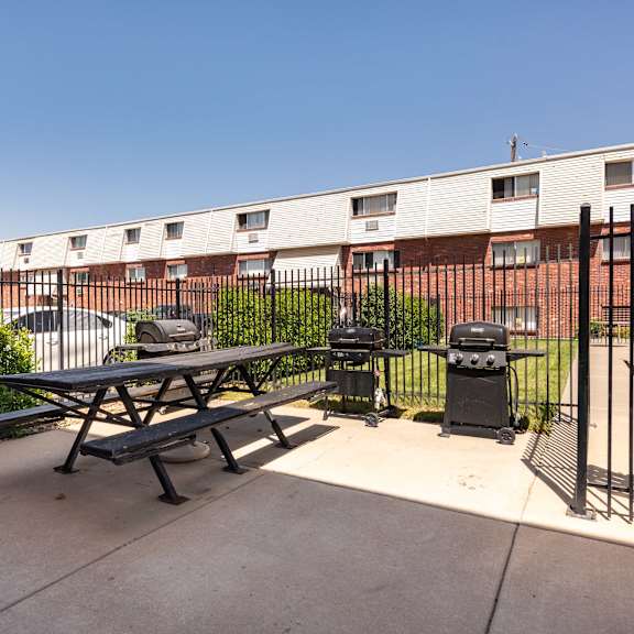 our apartments have a patio with a picnic table and grill