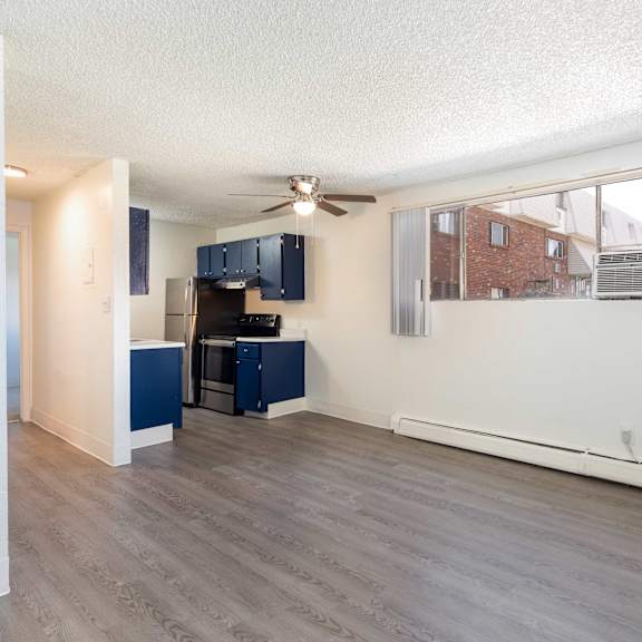kitchen with navy cabinets and a black refrigerator