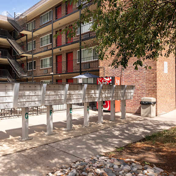 a bench in front of an apartment building