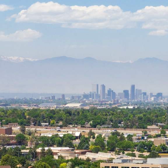 the city with the mountains in the background