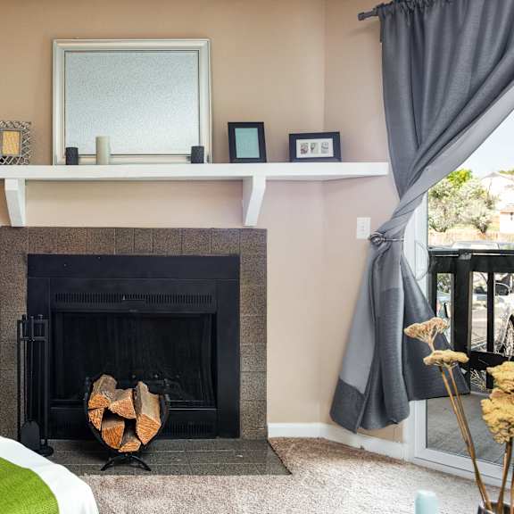 3d floor plan image of a living room with a fireplace in an aurora colorado apartment