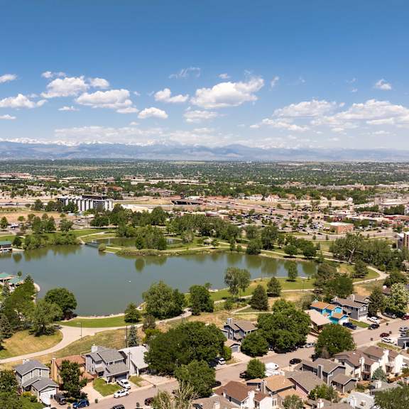 an aerial view of a lake in the middle of a city