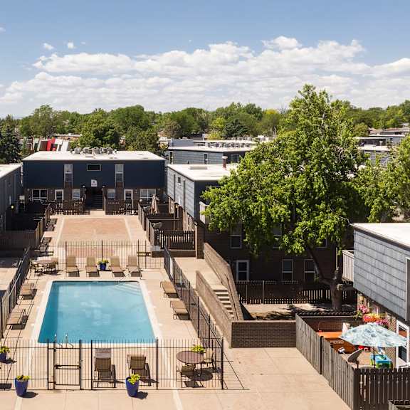 an aerial view of a pool in the middle of a building