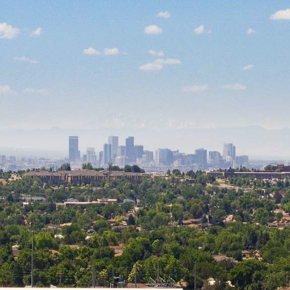 a view of the city from the top of a skyscraper