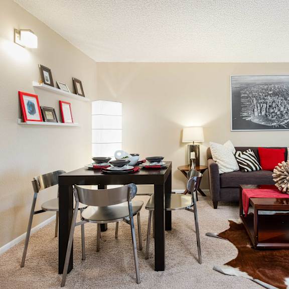 our apartments offer a living room and dining room with a table