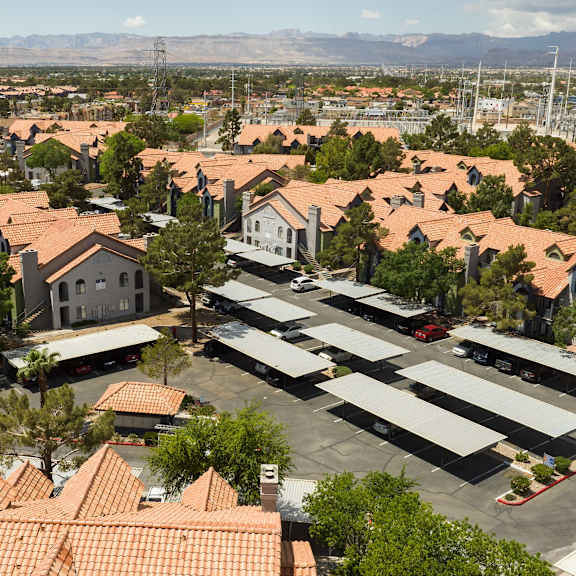 an aerial view of a suburban neighborhood with houses and cars