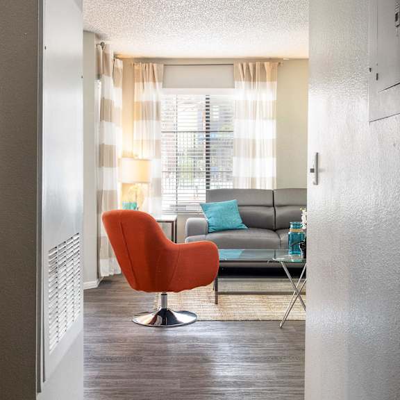 a living room with a couch and a chair