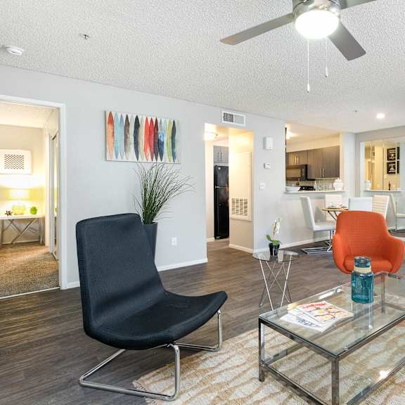 a living room with a couch and a glass table