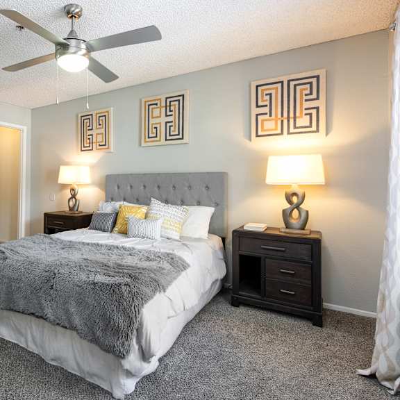 the preserve at ballantyne commons bedroom with bed and ceiling fan