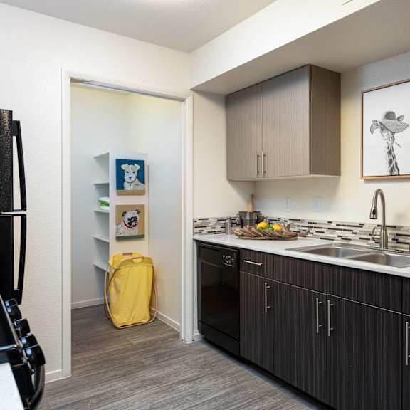 a kitchen with wooden cabinets and a white counter top