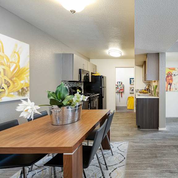 the living room and dining room of an apartment