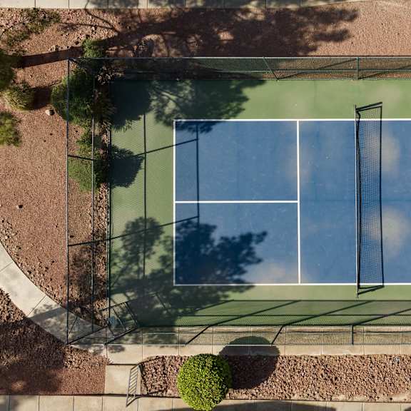 an aerial view of a tennis court on a