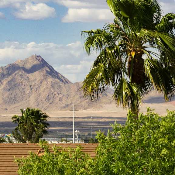 a view of a mountain and the ocean from a roof