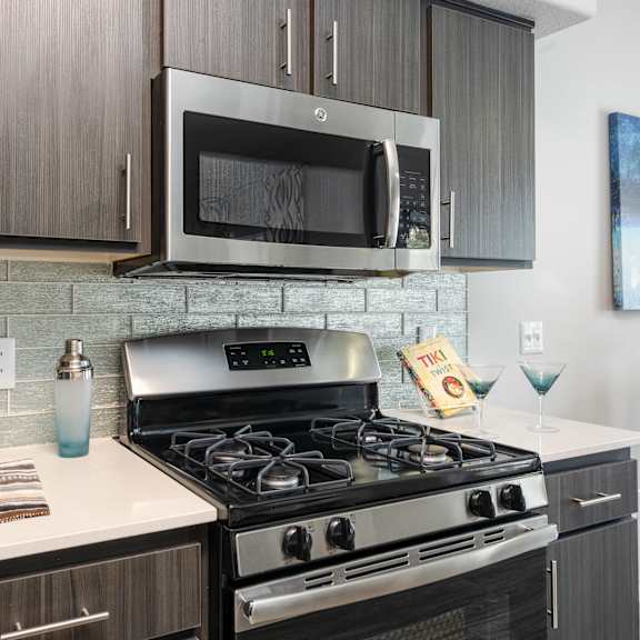 a kitchen with a stove and a microwave