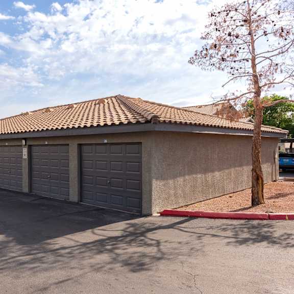 a parking lot with a row of garage doors