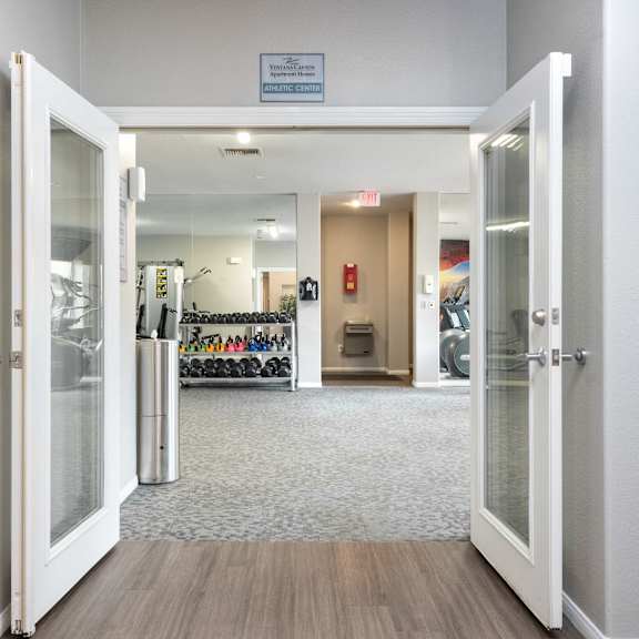 a view of a lobby with open doors and a wall with a bike rack
