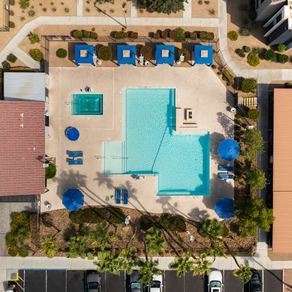 arial view of a house with a swimming pool in the middle of it