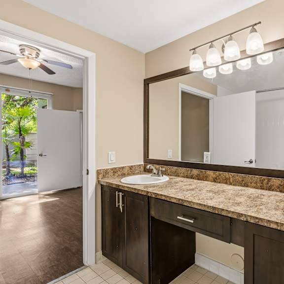 a bathroom with a double sink and a large mirror.