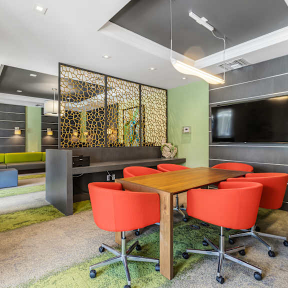 a conference room with a long table and chairs.