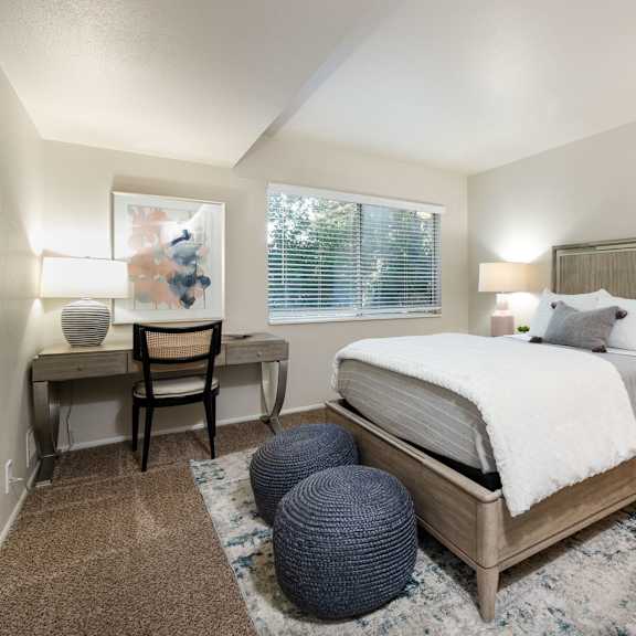 a bedroom with a bed and a round window