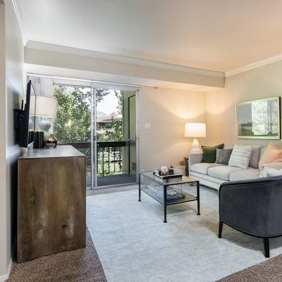 a living room with a couch and a chair
