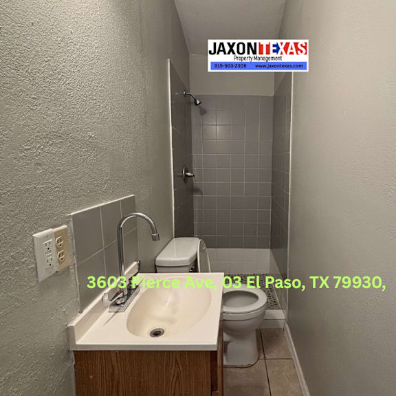 a bathroom with a sink, toilet and shower.