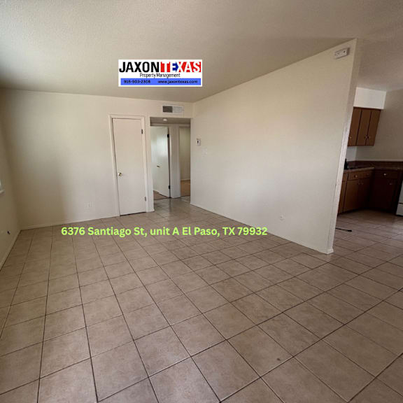 a room with a tiled floor and a sign that says "jaxontexas" on the wall.
