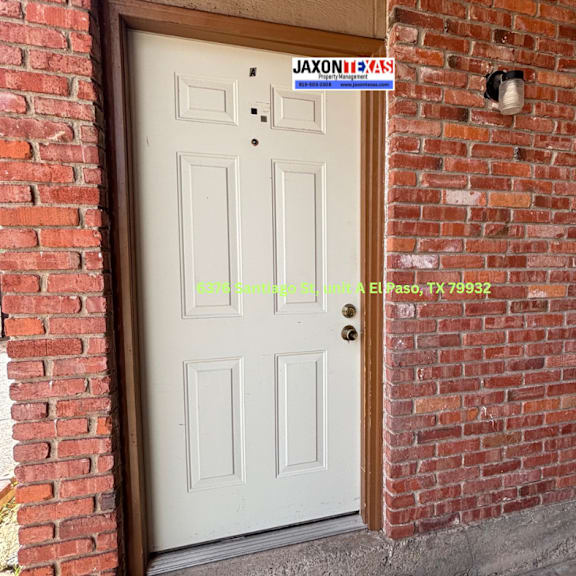 a white door with a sign that says "jaxon's" above it.