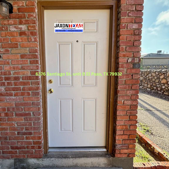 a white door with a sign that says "jaxon's" on it.