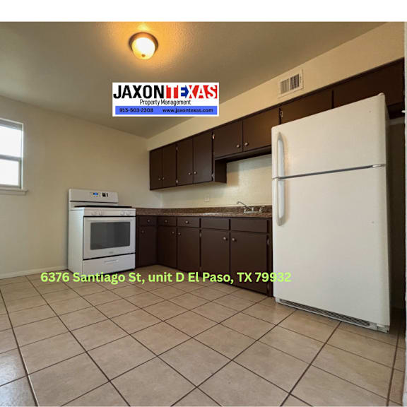 a kitchen with a white refrigerator and a white oven.
