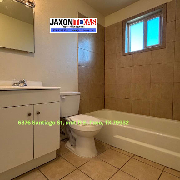 a bathroom with a toilet, sink, and bathtub.