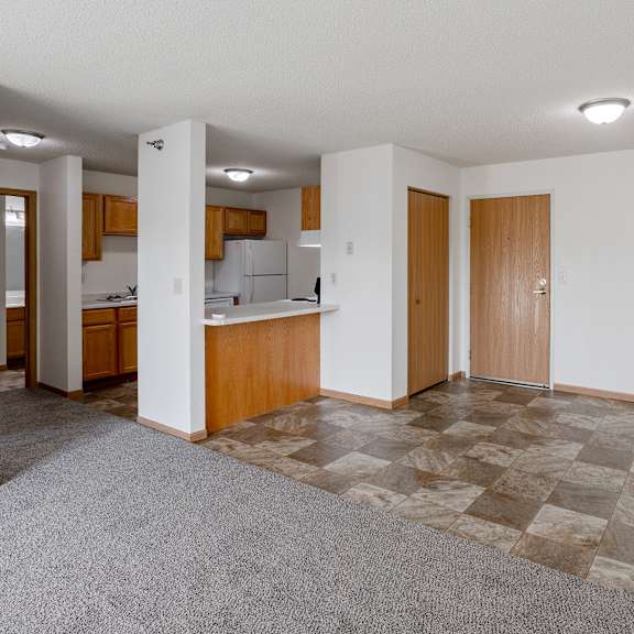 empty living room and kitchen at hillcrest apartments, mn, 56301
