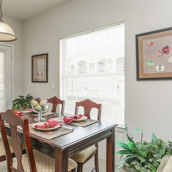 a dining room with a table set for a meal.