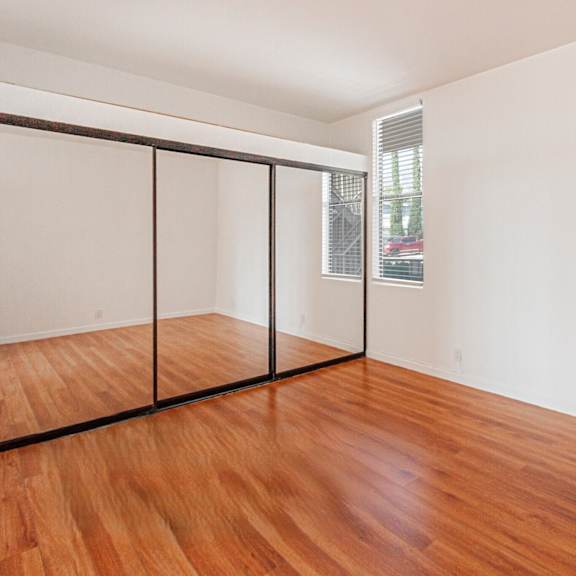a room with a wooden floor and a sliding door.