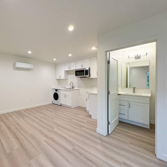a spacious room with a washer and dryer in it.