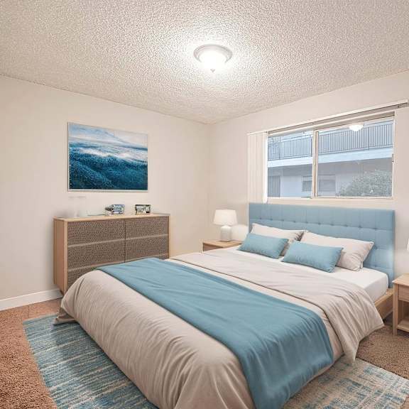 a bedroom with a bed, nightstand, and a painting on the wall.