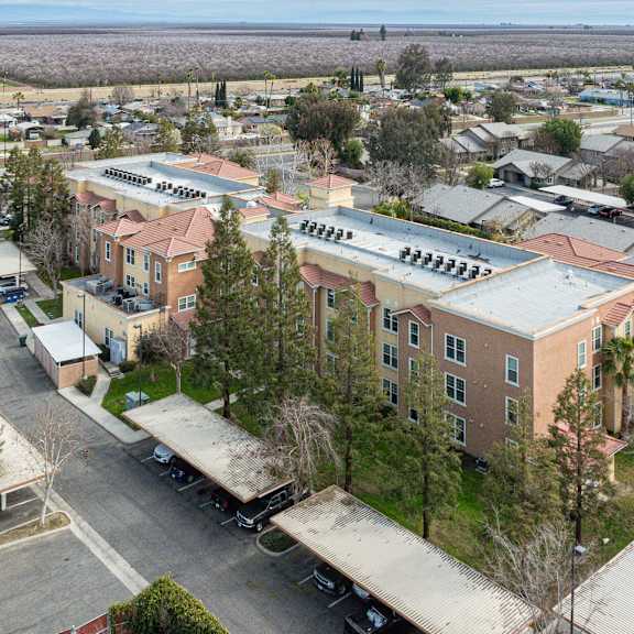 a large building with a parking lot in front of it.