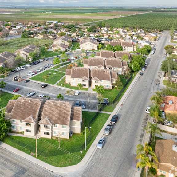 a suburban neighborhood with houses and a road.