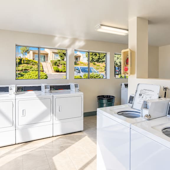 a laundromat with washers and dryers is shown.