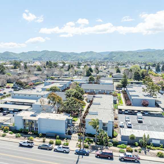 a view of a town with a lot of buildings and cars.