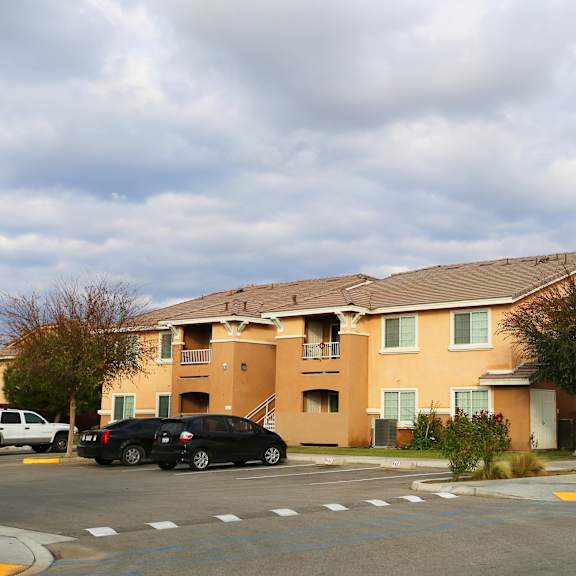 a building with a parking lot in front of it.