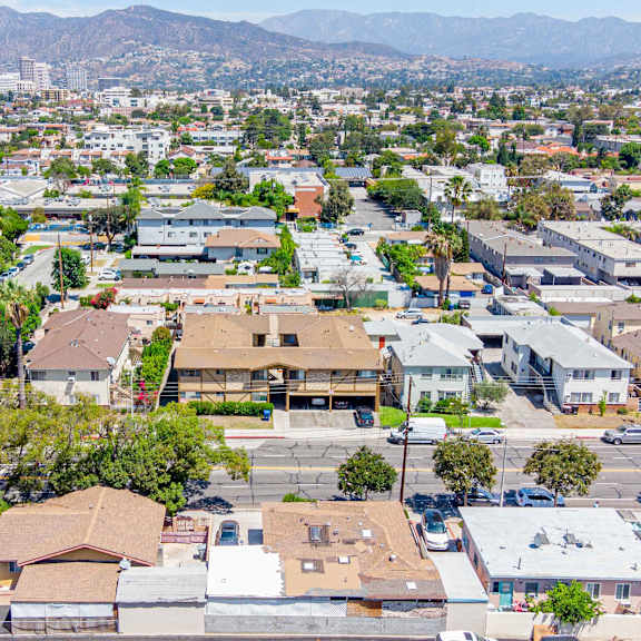a view of a residential area with houses and trees.