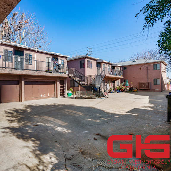 a sunny day at a residential complex with a clear blue sky.