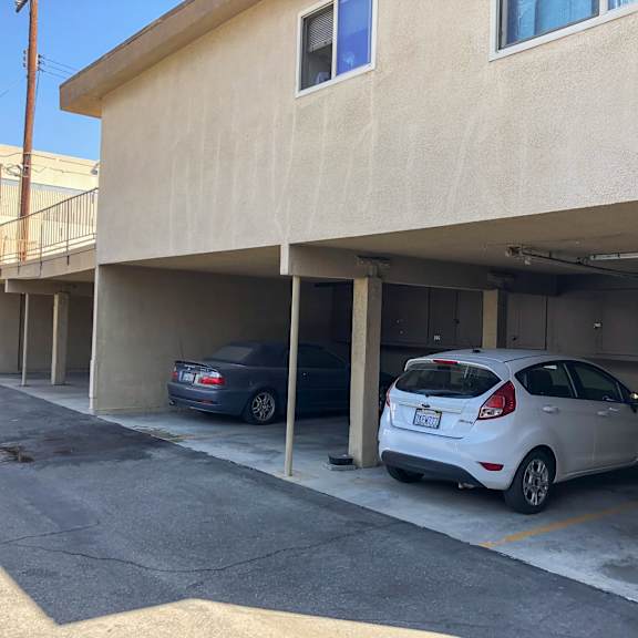two cars are parked in a parking garage.