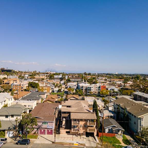 a residential area with houses and cars.