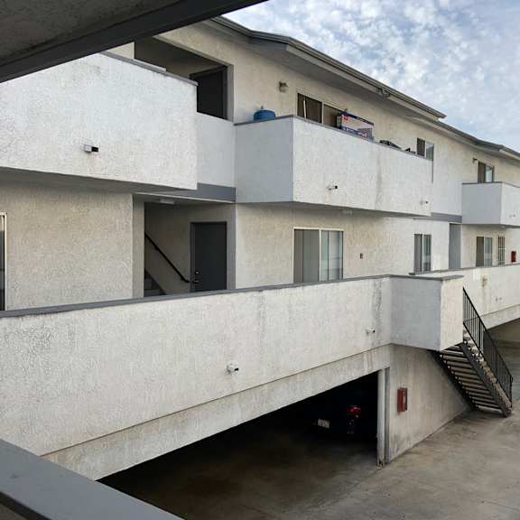 a concrete building with multiple floors and staircases.