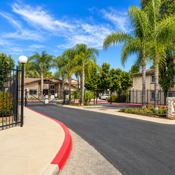 a street view of oak terrace senior apartments with a sign in the foreground.